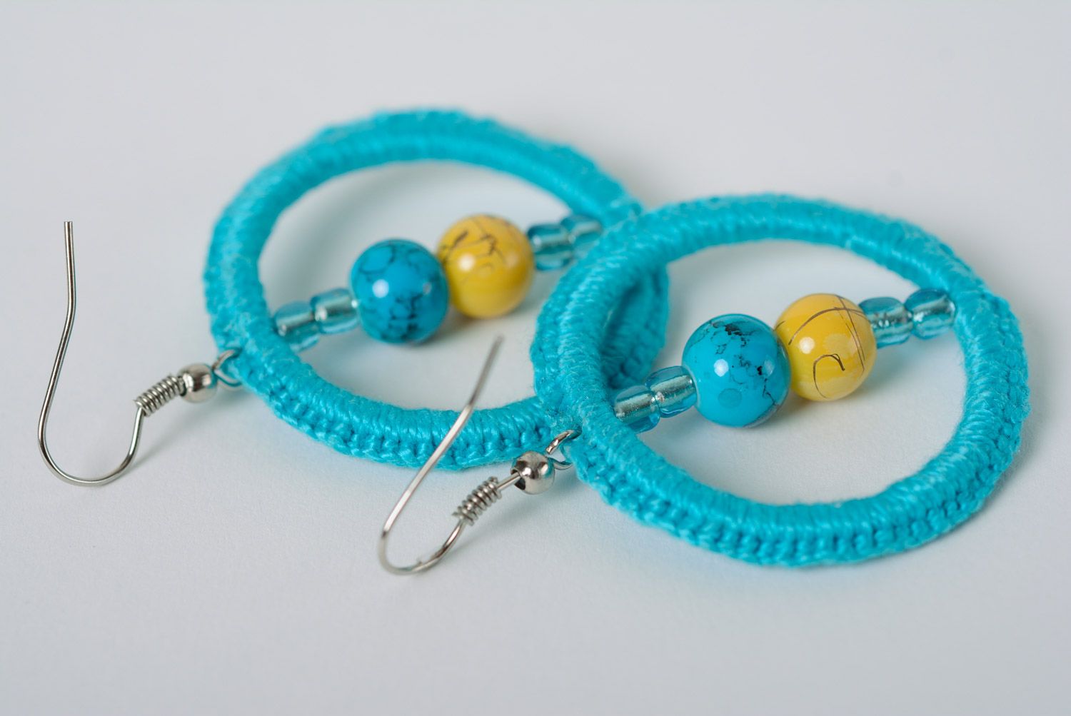 Handmade ring-shaped earrings with beads crocheted over with cotton threads photo 4