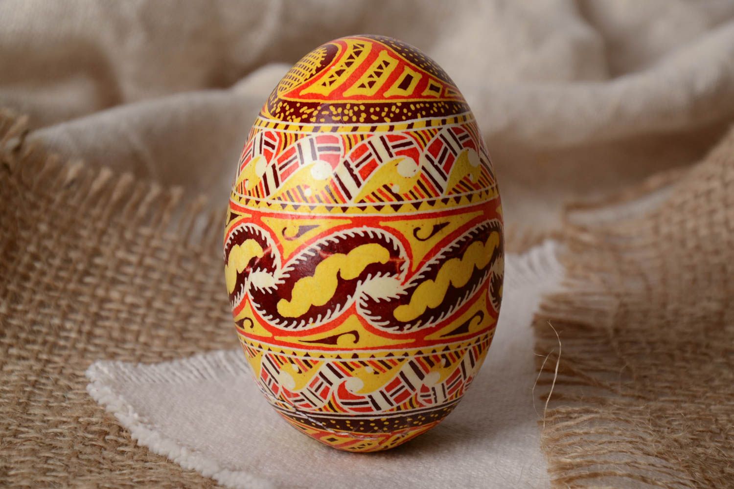 Homemade designer decorative Easter egg pysanka painted with wax and aniline dyes photo 1