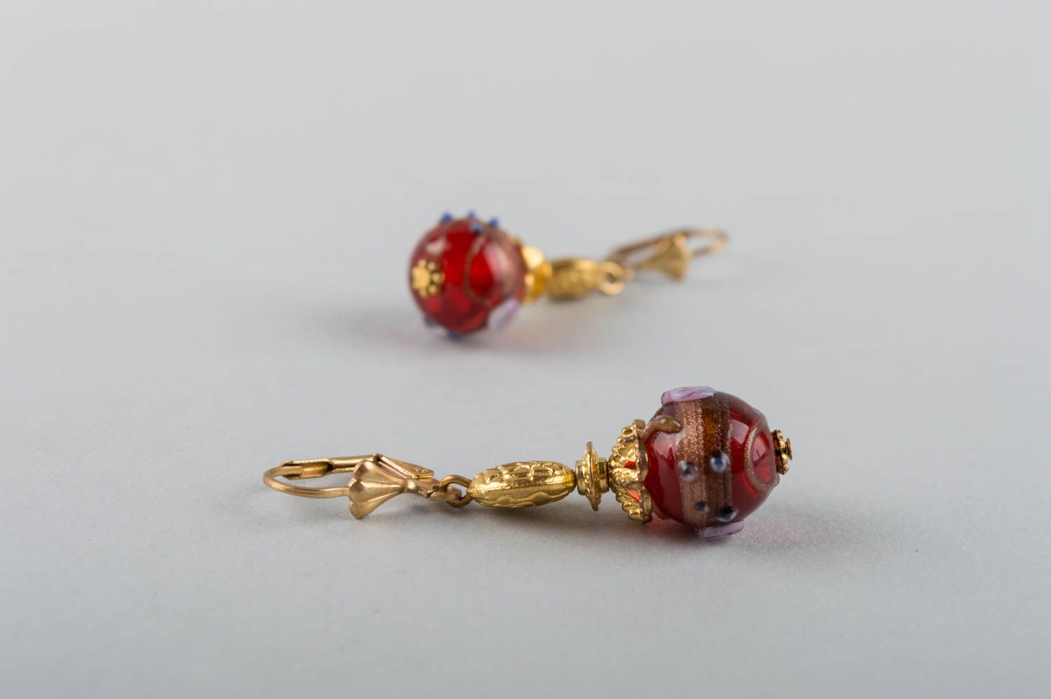 Handmade luxurious dangling earrings with golden colored basis and mural glass photo 5
