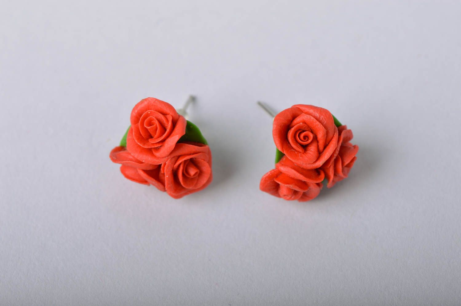 Handmade flower stud earrings made of cold porcelain in shape of red roses photo 2