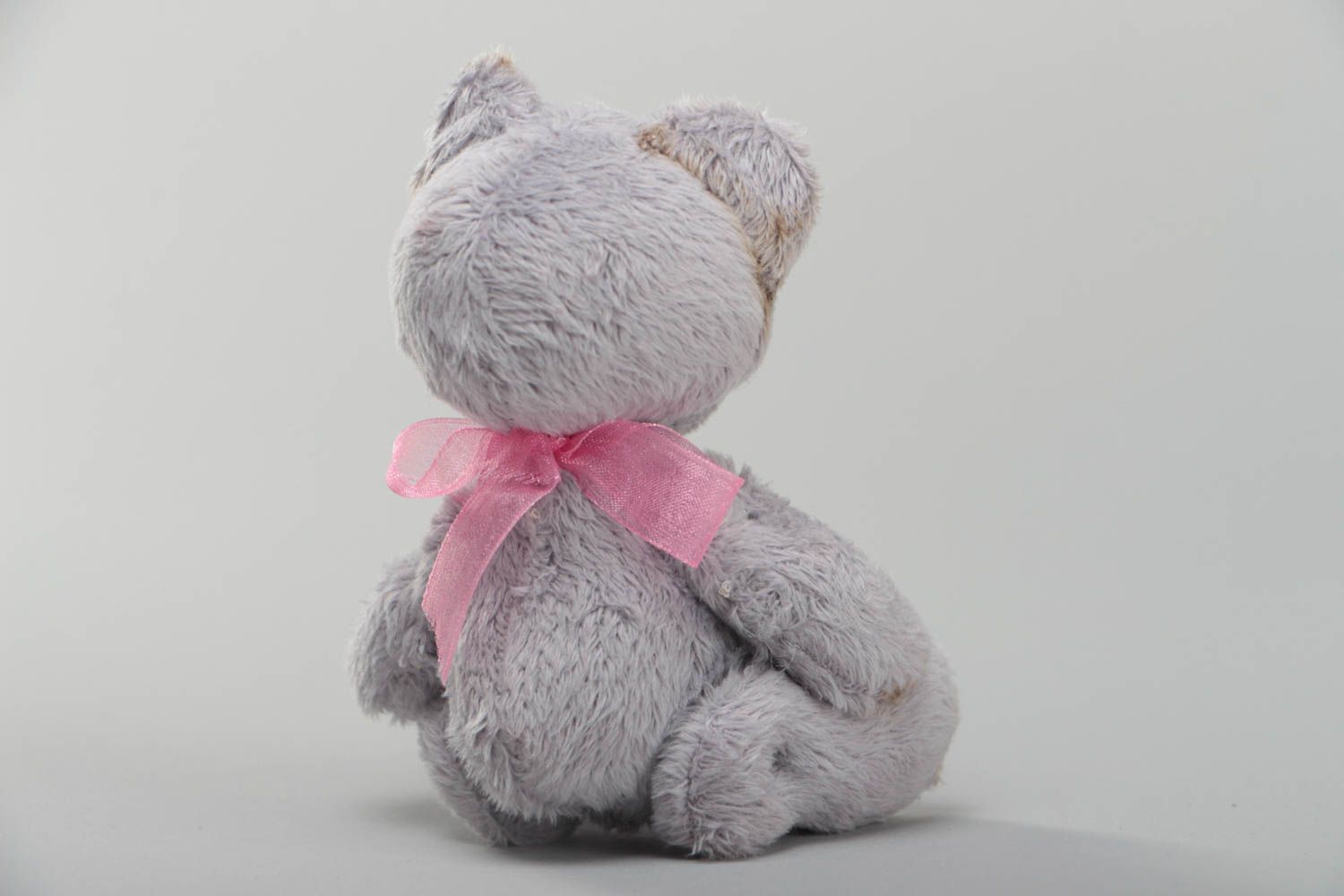 Handmade small faux fur soft toy bear of gray color with pink bow for children photo 4