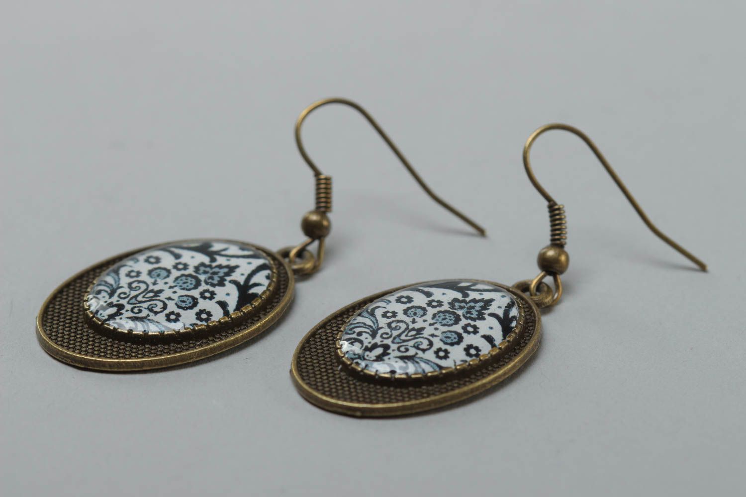 Handmade vintage metal earrings of oval shape with patterns coated with glaze photo 3
