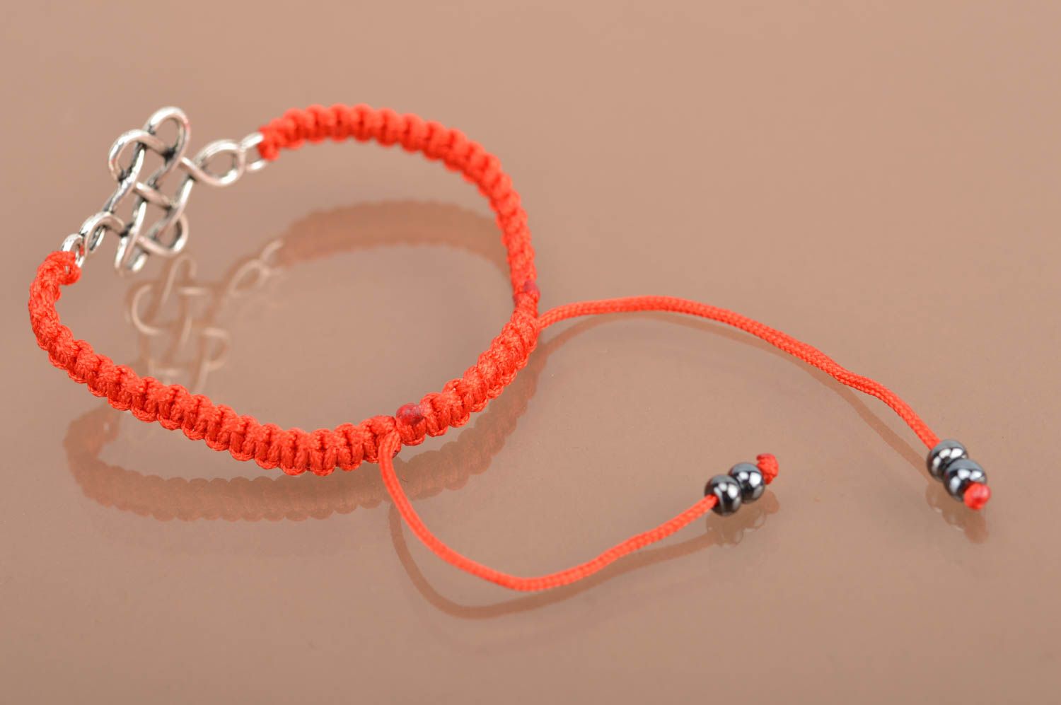 Handmade beautiful red bracelet made of silk threads with metal insert photo 4