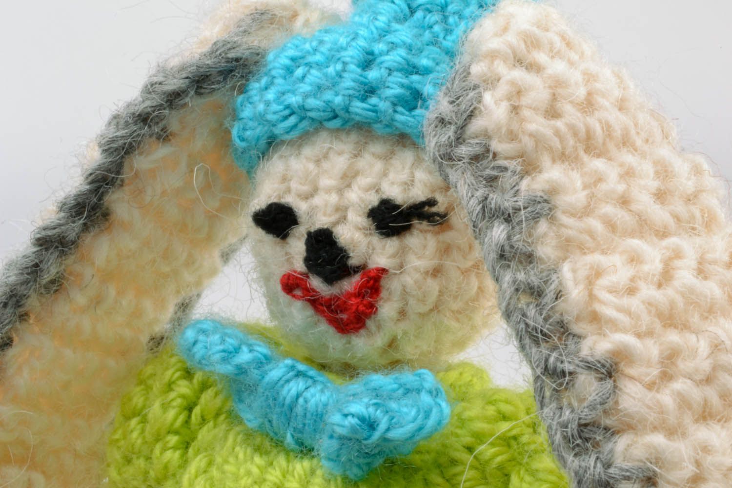 Soft toy hare in green photo 2