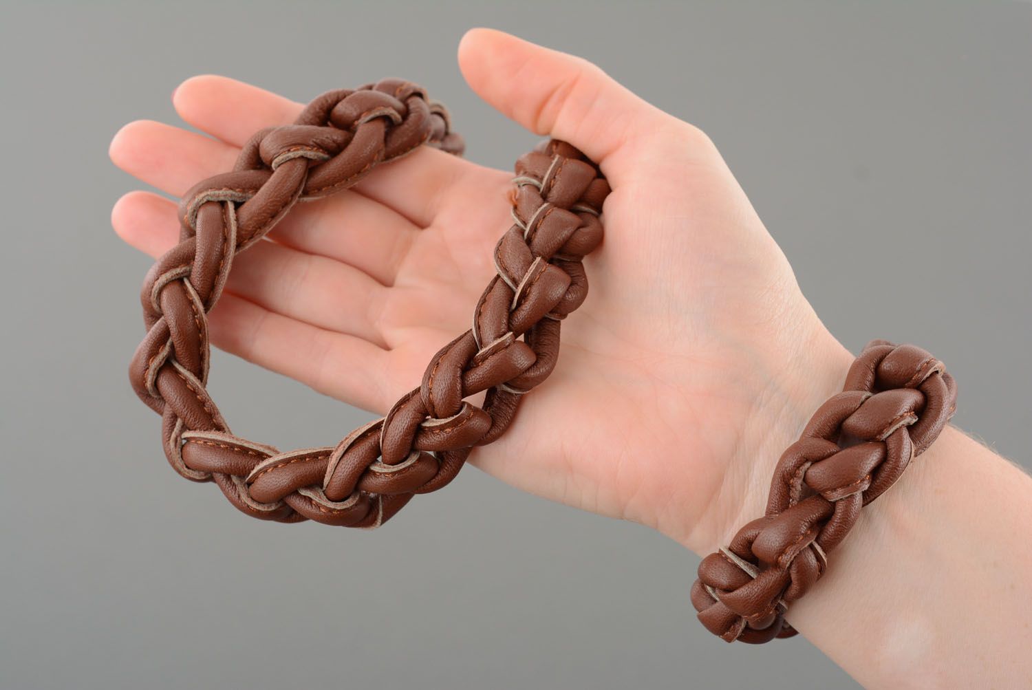 Leather necklace and bracelet in brown color photo 2