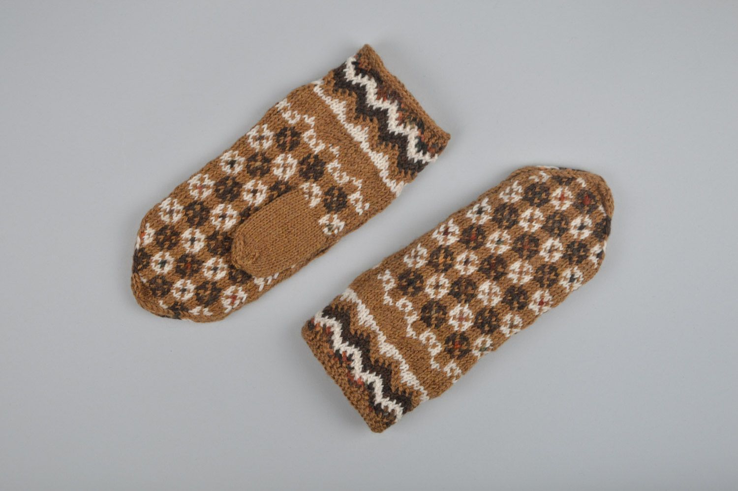 Handmade warm winter women's brown mittens knitted of wool with ornament photo 4