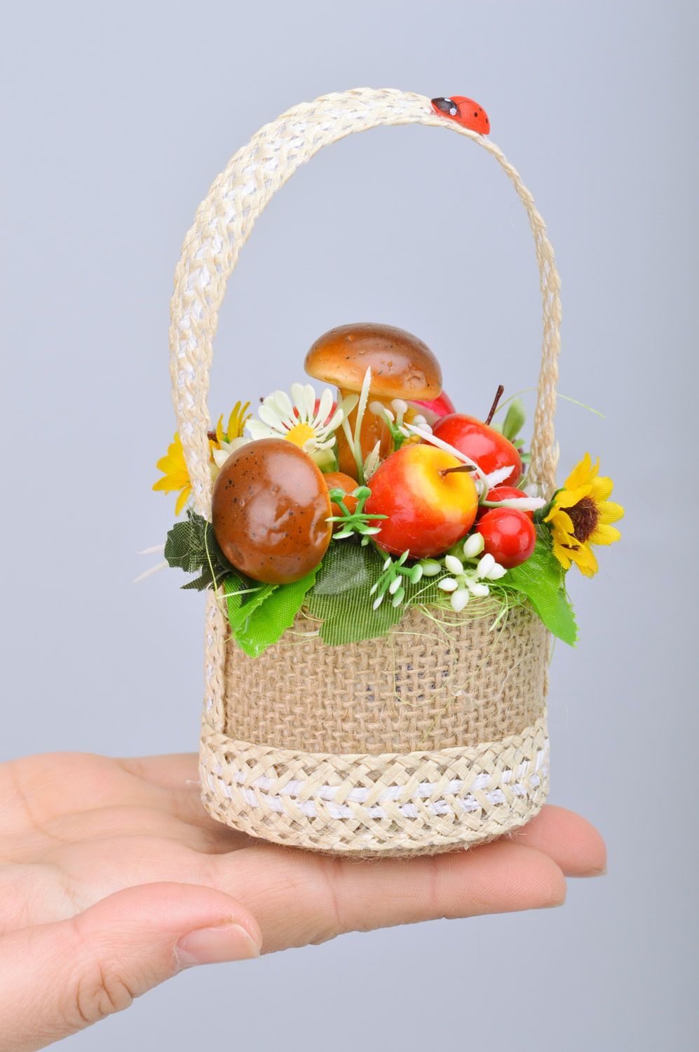 Small handmade decorative basket with mushrooms and fruit interior composition photo 3