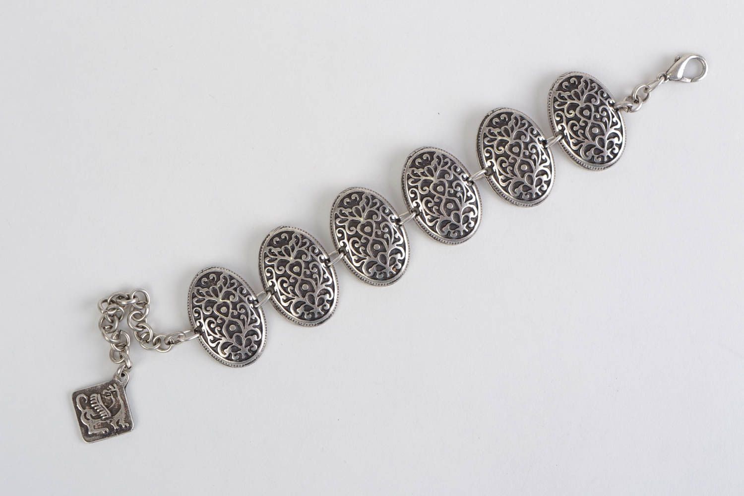 Handmade designer wrist bracelet cast of metal alloy in special molds for women photo 4