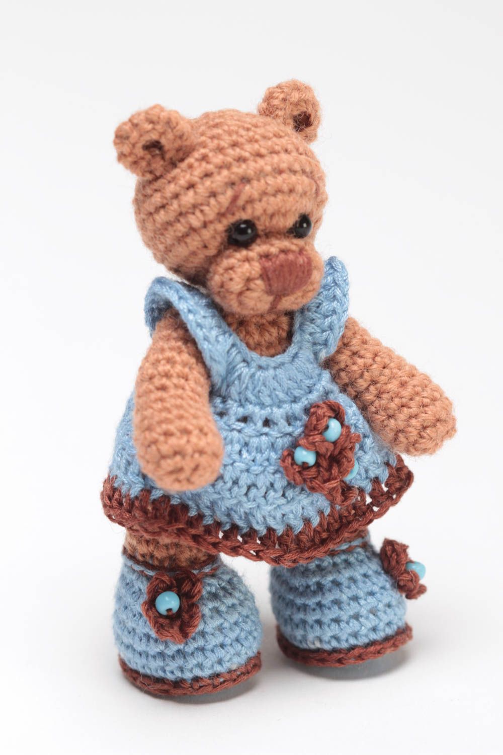 Handmade small crocheted soft toy brown bear girl in blue dress and shoes  photo 2