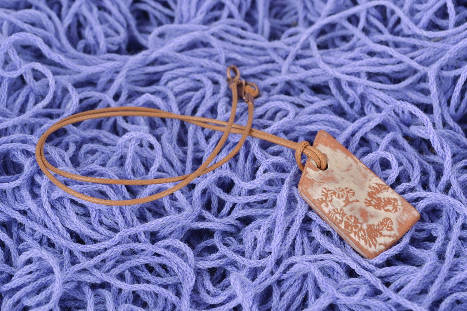 Handmade ceramic pendant with cord photo 1