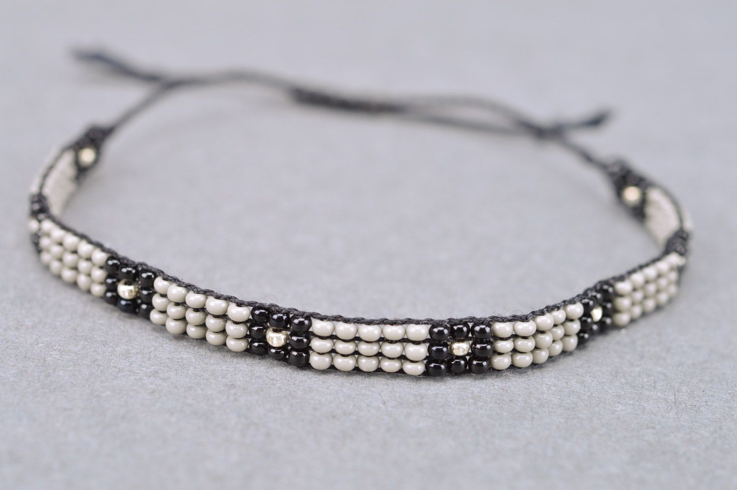 Beautiful black and gray thin beaded bracelet with ties for men photo 3