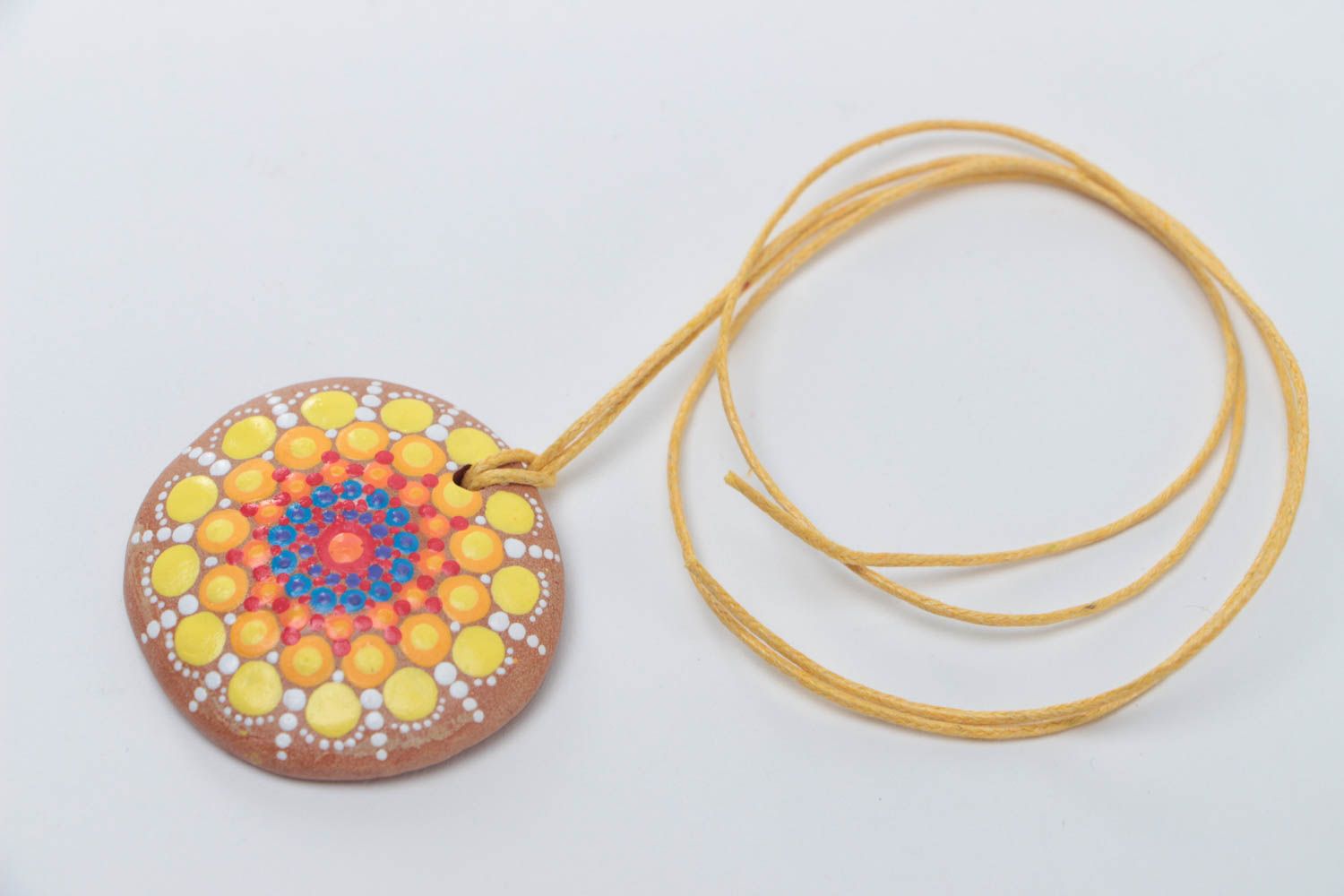 Unusual handmade designer ceramic round pendant with bright dot painting on cord photo 2