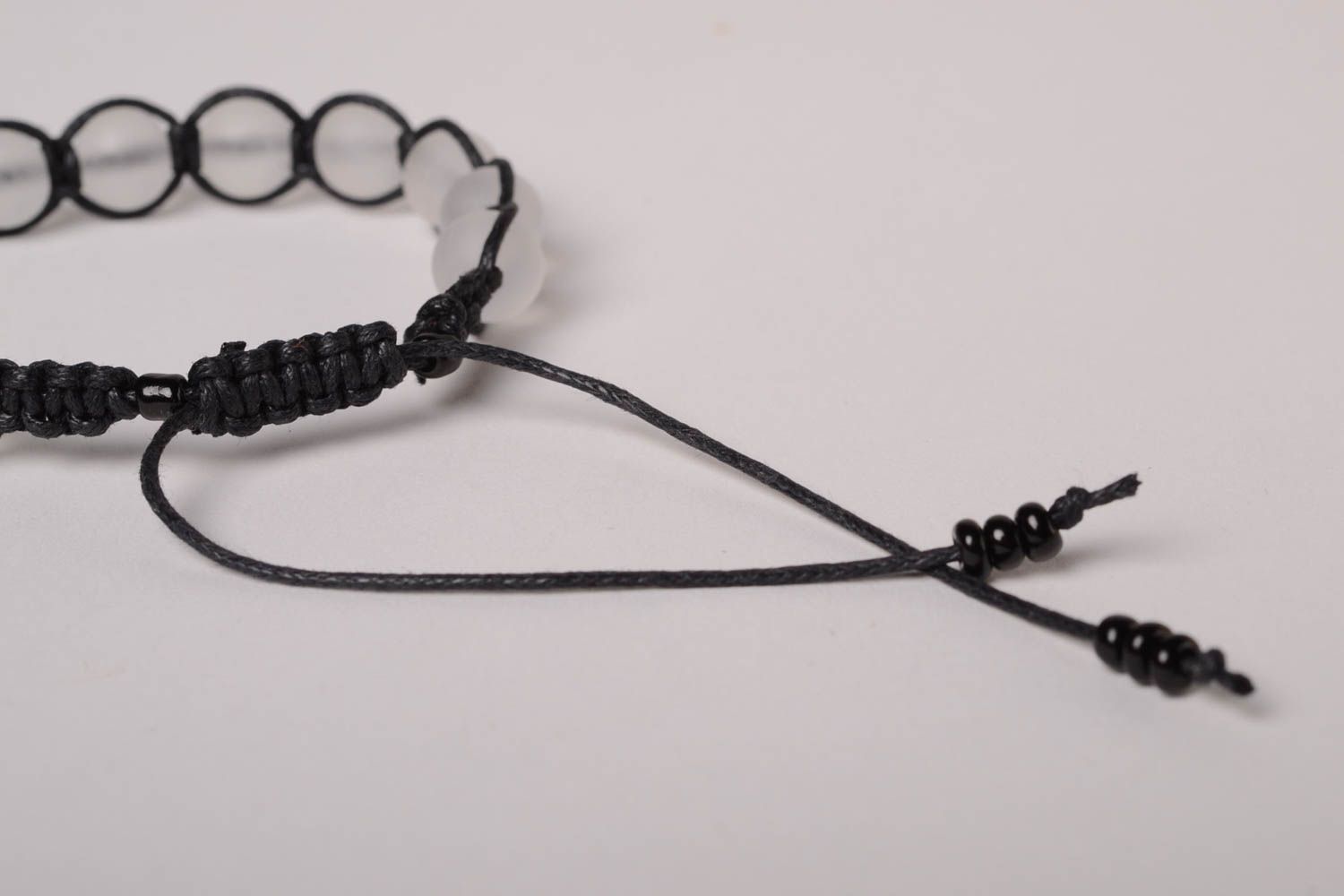 Transparent beads strand bracelet with black cord photo 5