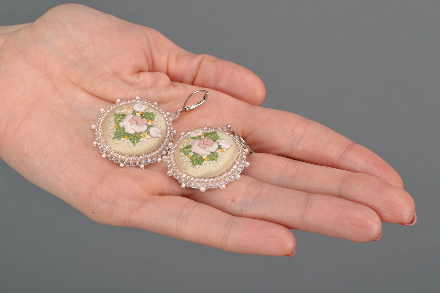 Round embroidered earrings on leather basis photo 2