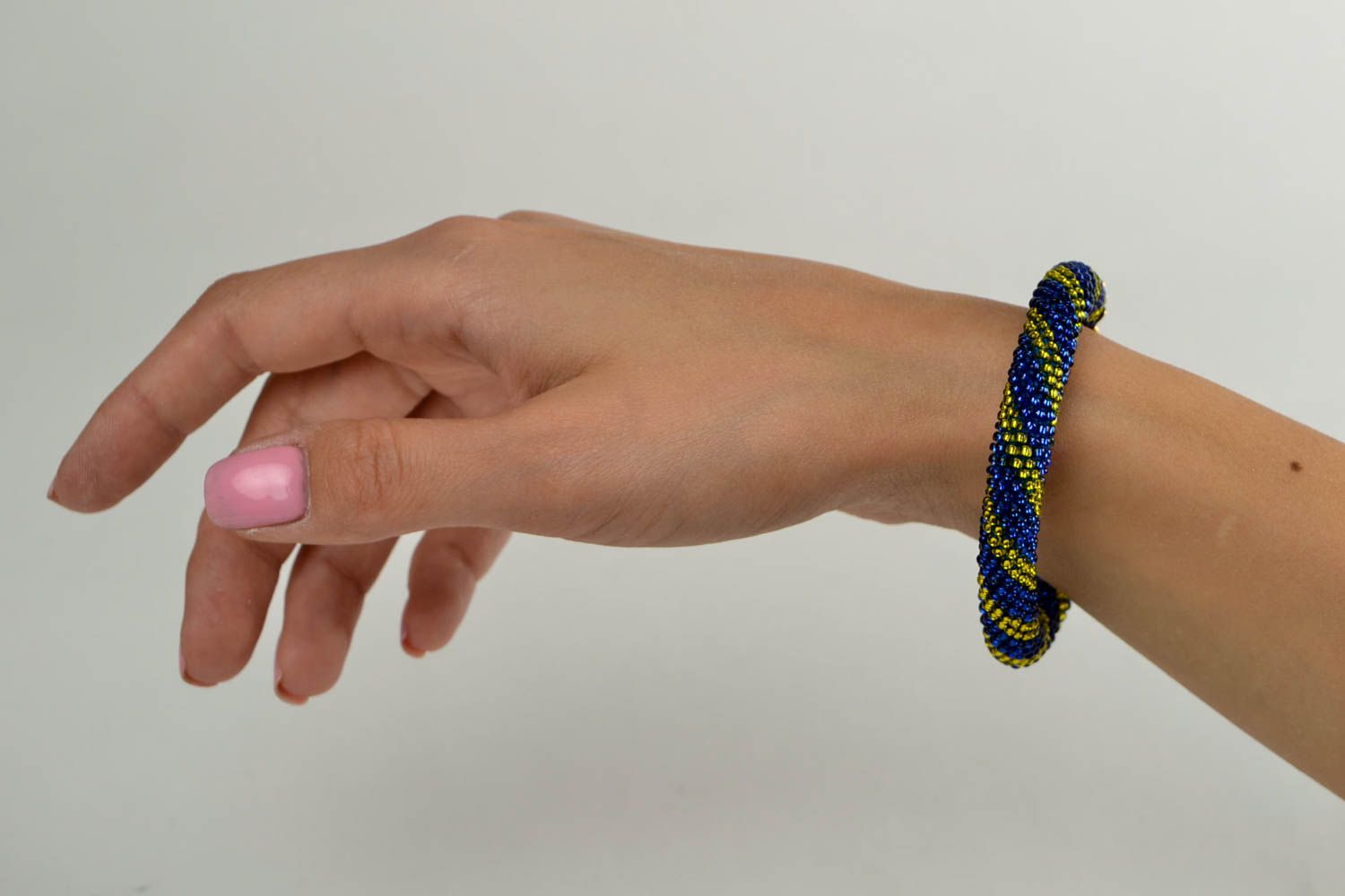Beaded cord bracelet in dark blue and yellow beads for young girls photo 1