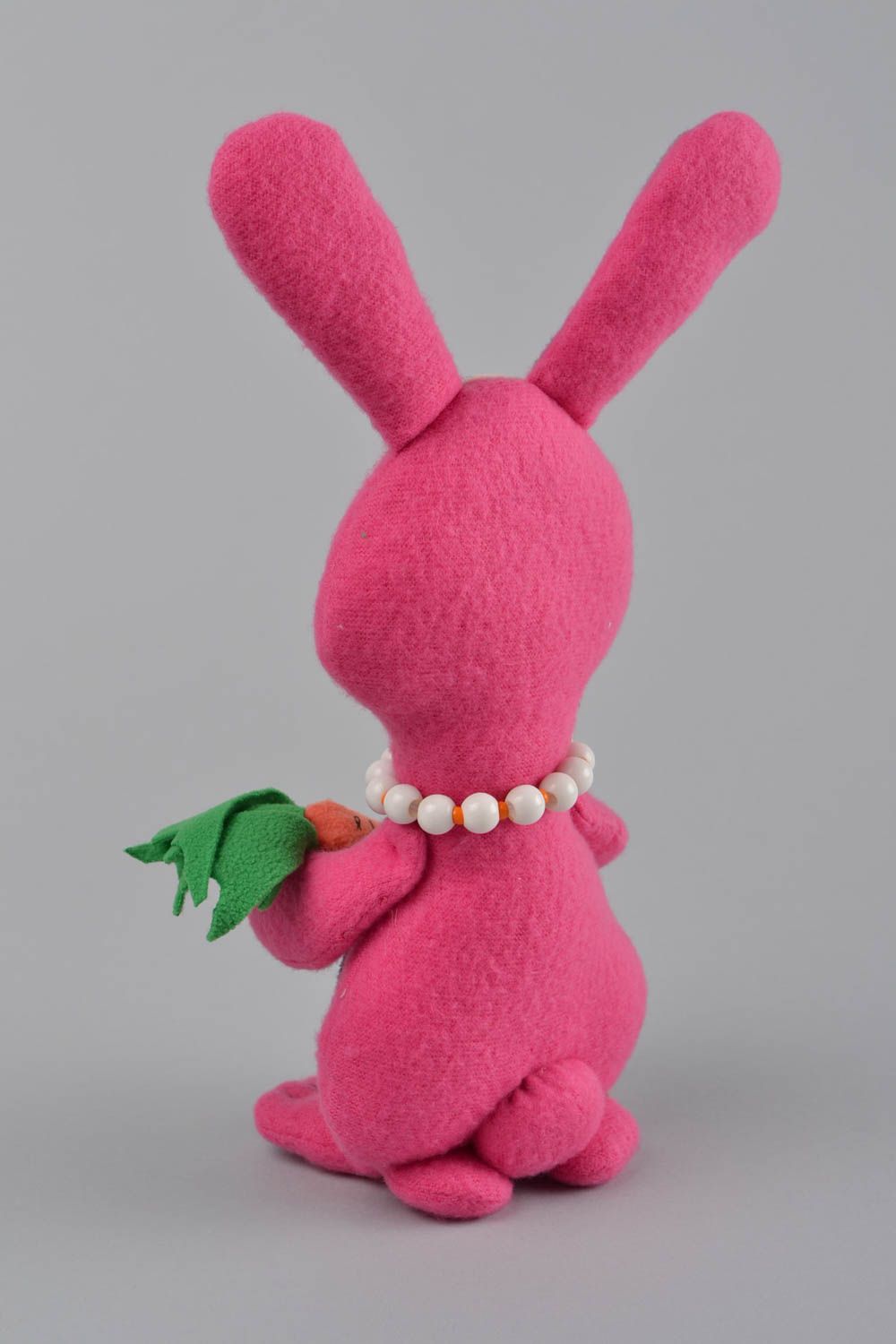 Handmade designer small soft toy sewn of fleece pink rabbit with carrot photo 5