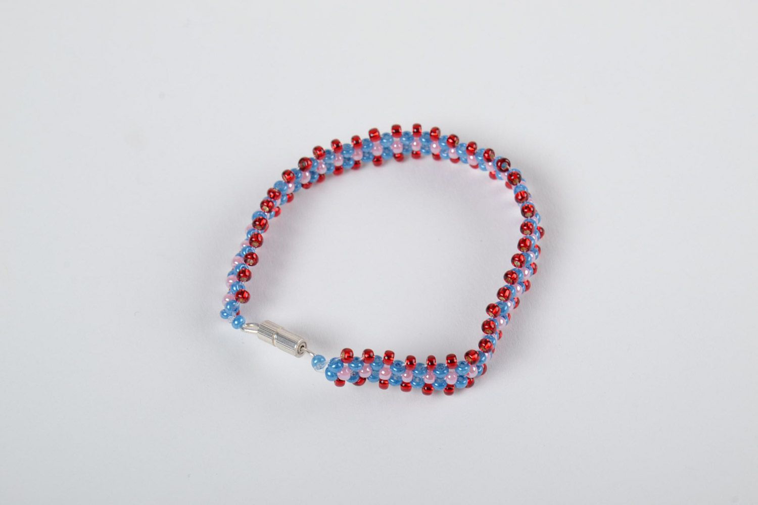 Girls' beaded bracelet made of Czech beads of red, pink, and dark blue color photo 2