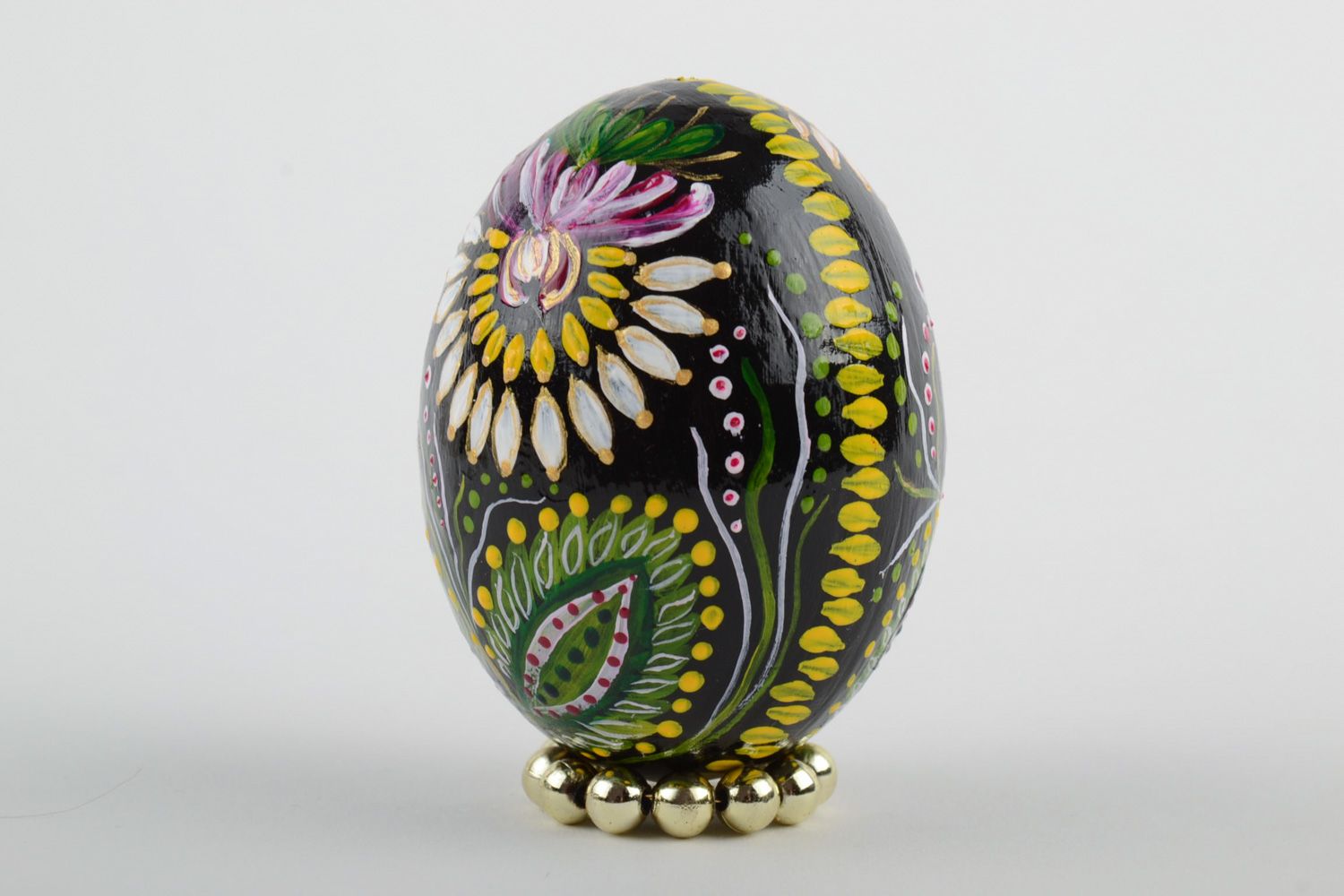 Handmade wooden Easter egg painted with floral ornaments for interior decoration photo 2
