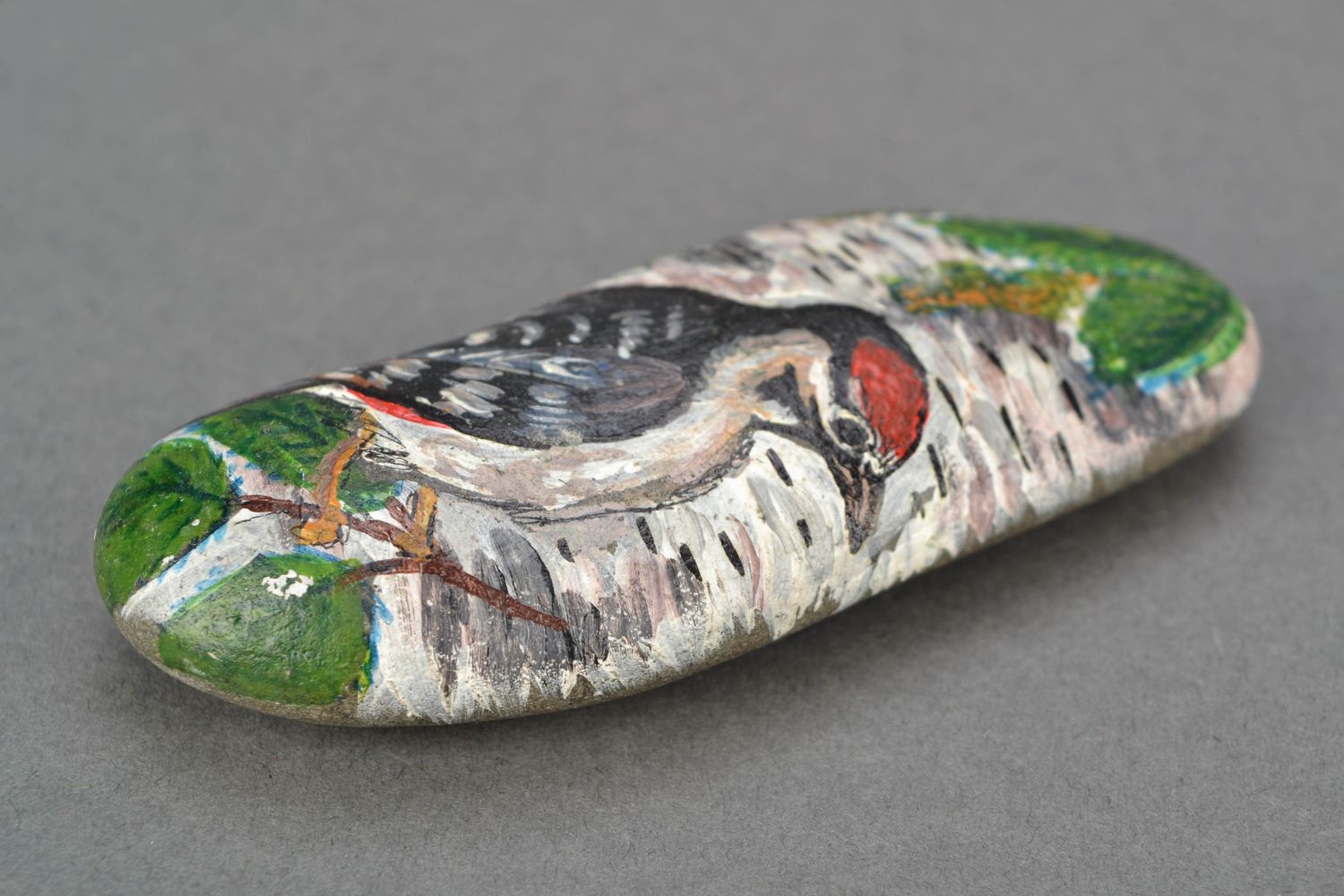 Painted sea stone for decor Woodpecker photo 3