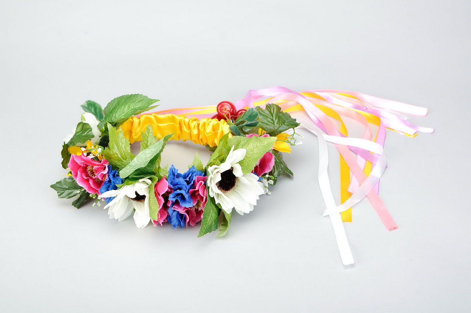 Ukrainian wreath made of artificial flowers and cherries photo 1