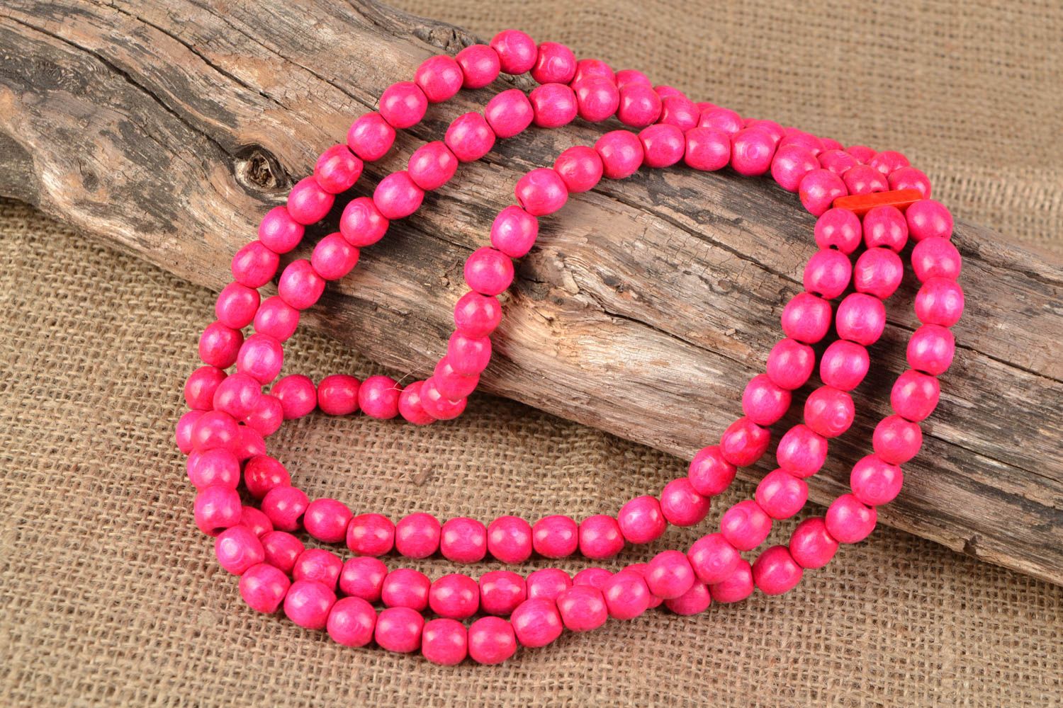 Pink handmade wooden bead necklace in three rows photo 1