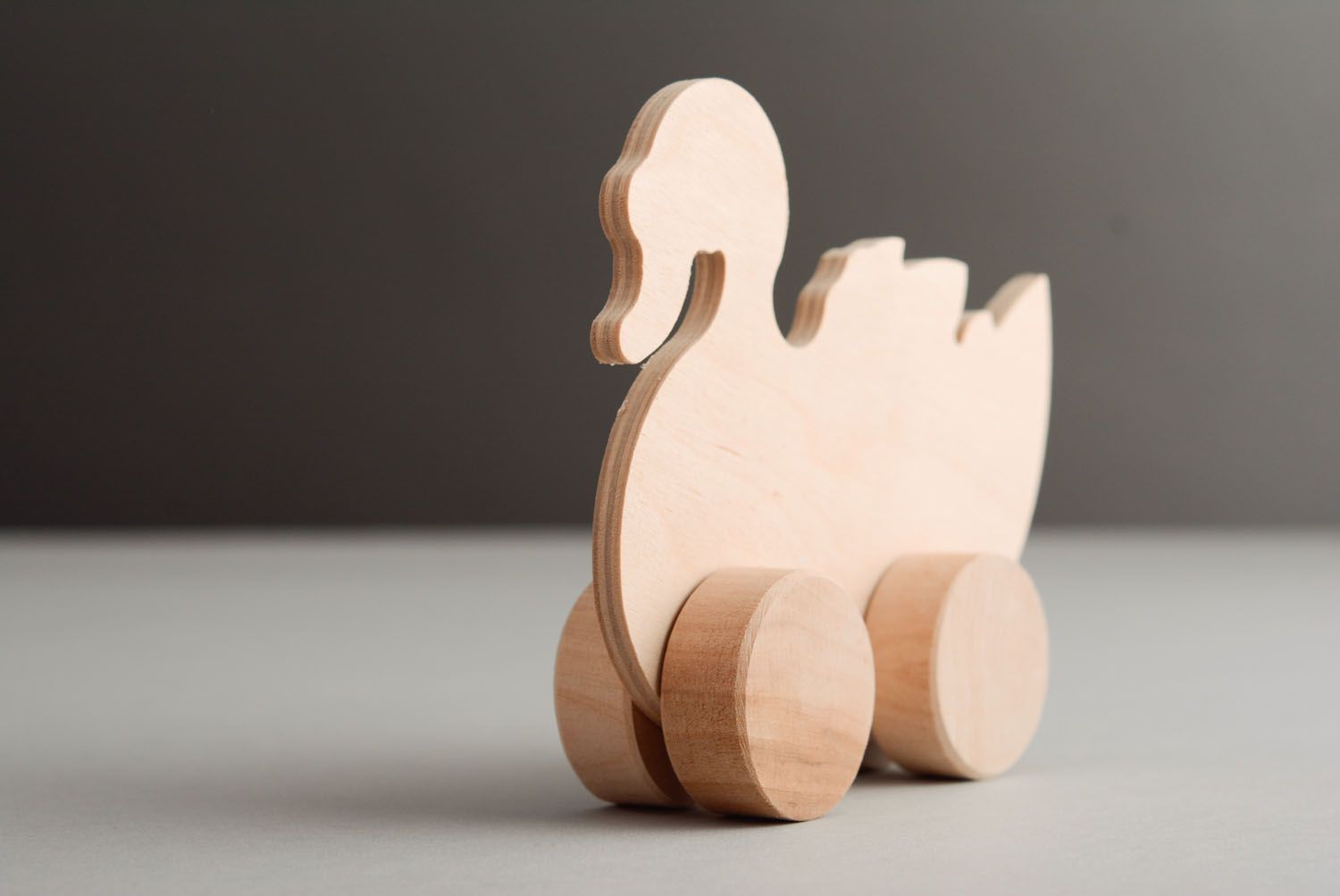 Wooden toy with wheels Swan photo 2