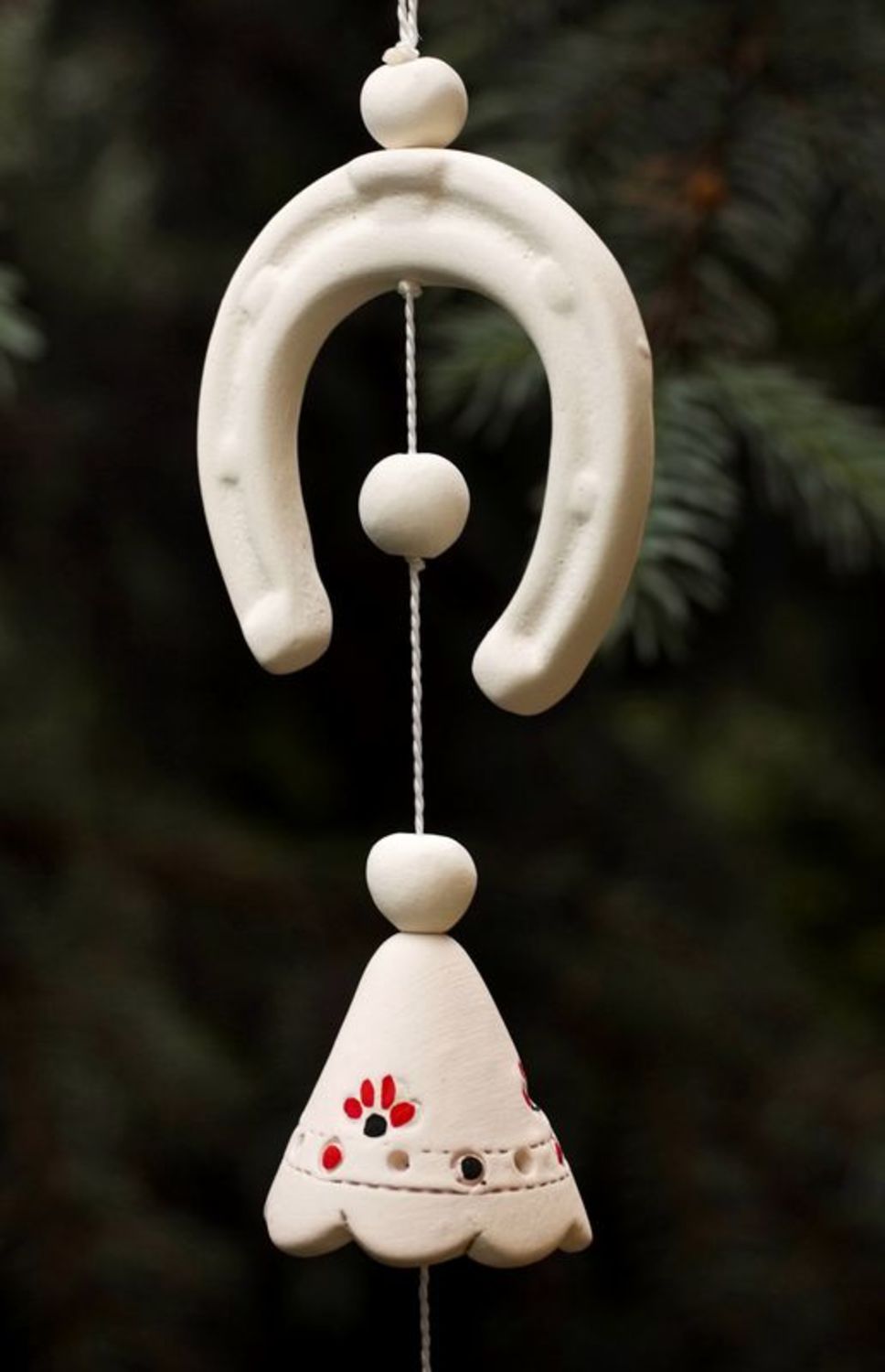 Hanging ceramic bell with horseshoe photo 1