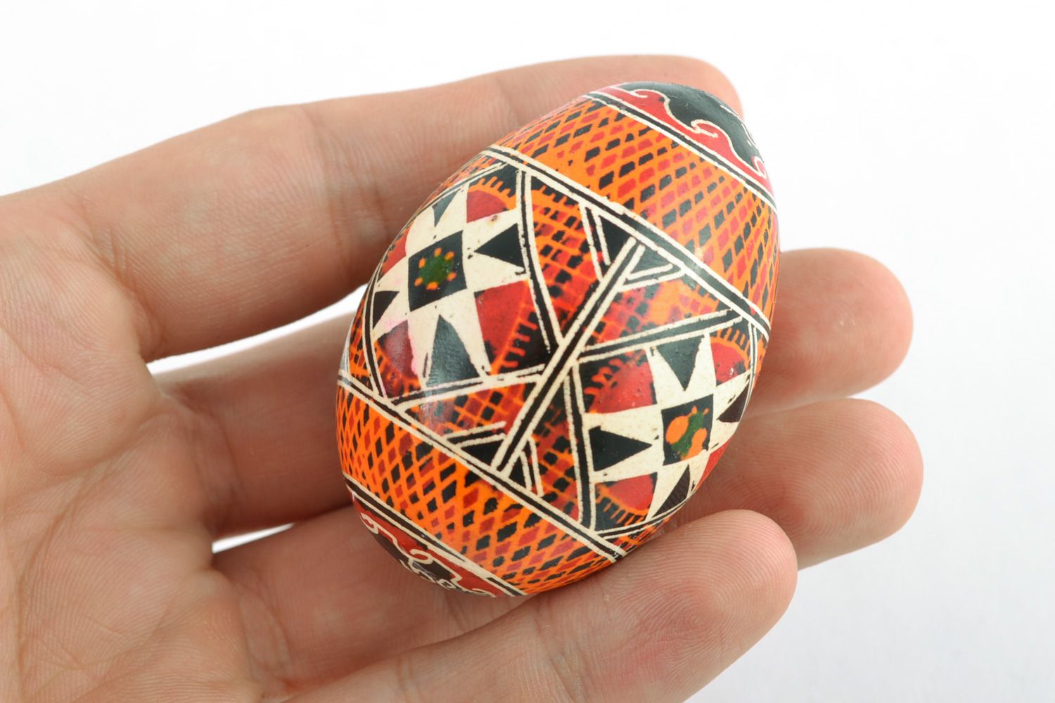 Traditional Easter egg pysanka with handmade painting made using wax technique photo 2