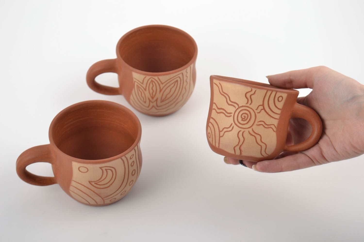 Set of three ceramic cups for coffee with cave drawings photo 5