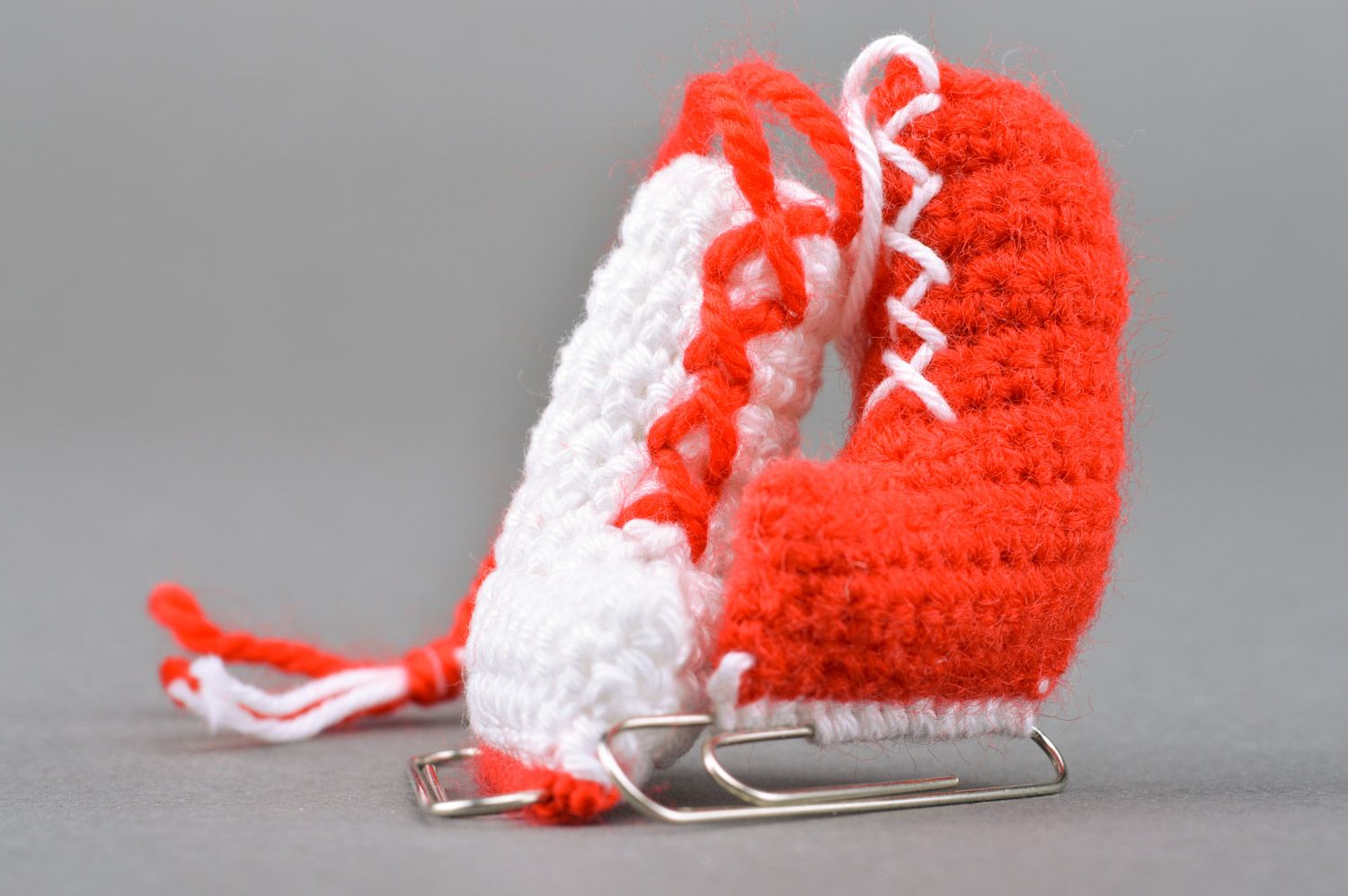 Unusual handmade crochet soft interior pendant in the shape of skates with paper clips photo 2