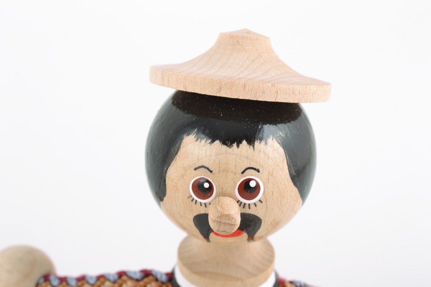 Homemade painted wooden eco toy in the shape of man in Ukrainian costume photo 3