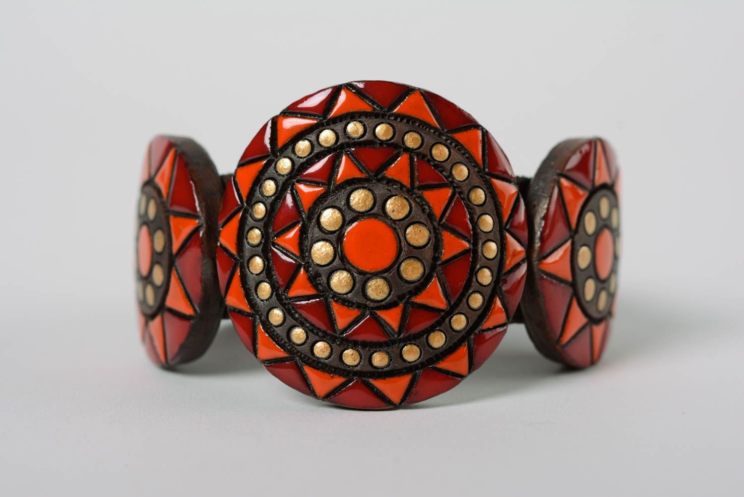 Handmade large clay bracelet ornamented with paints and equipped with leather strap photo 1