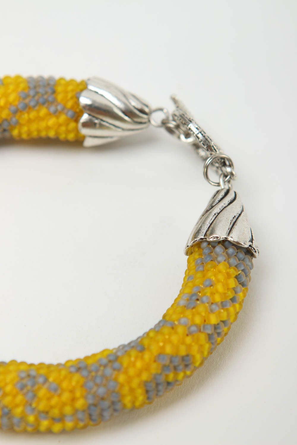 Gray and yellow color handmade beaded cord bracelet with metal fittings photo 4