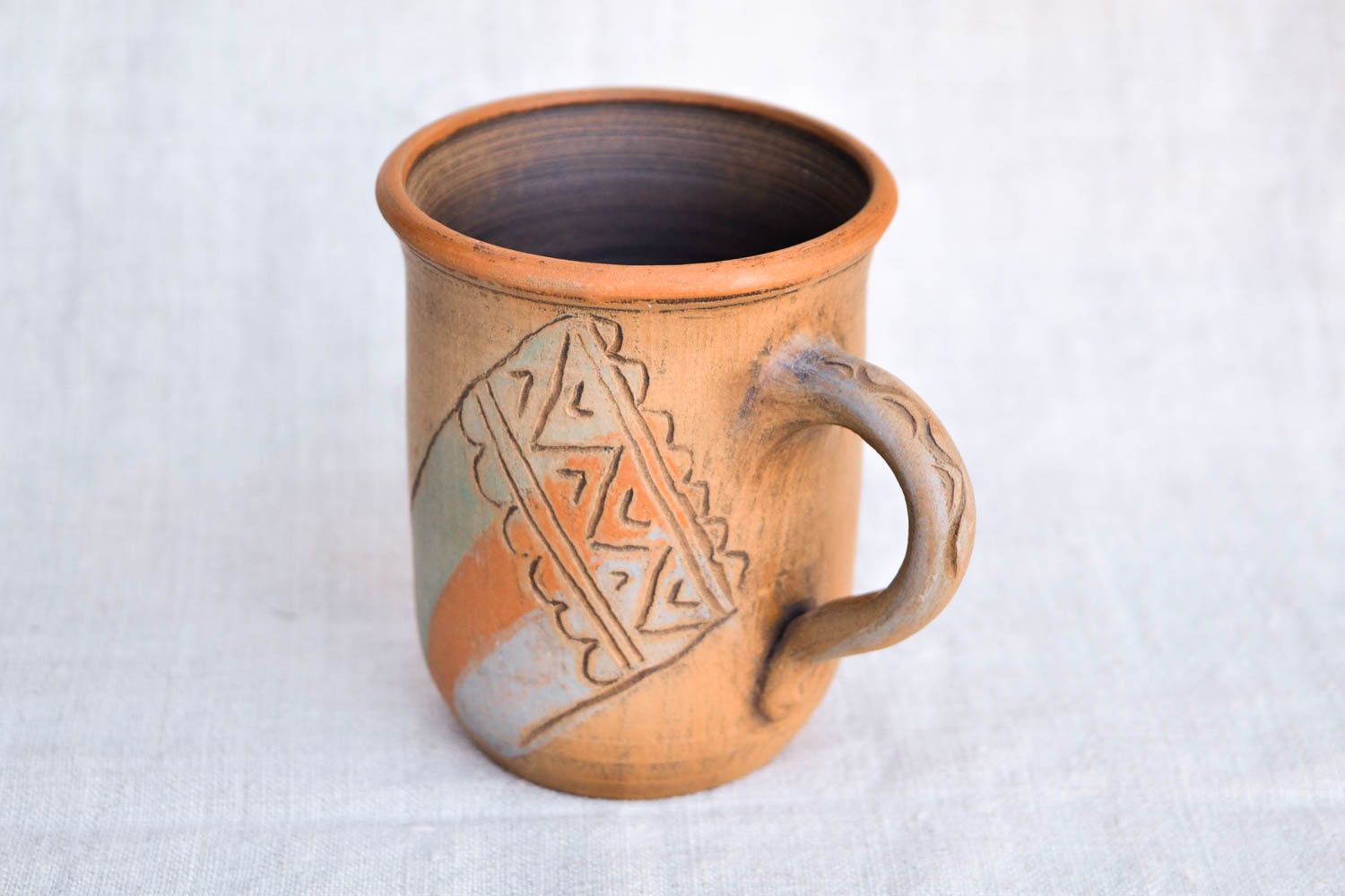 Tall drinking mug in brown, orange, and olive colors photo 2