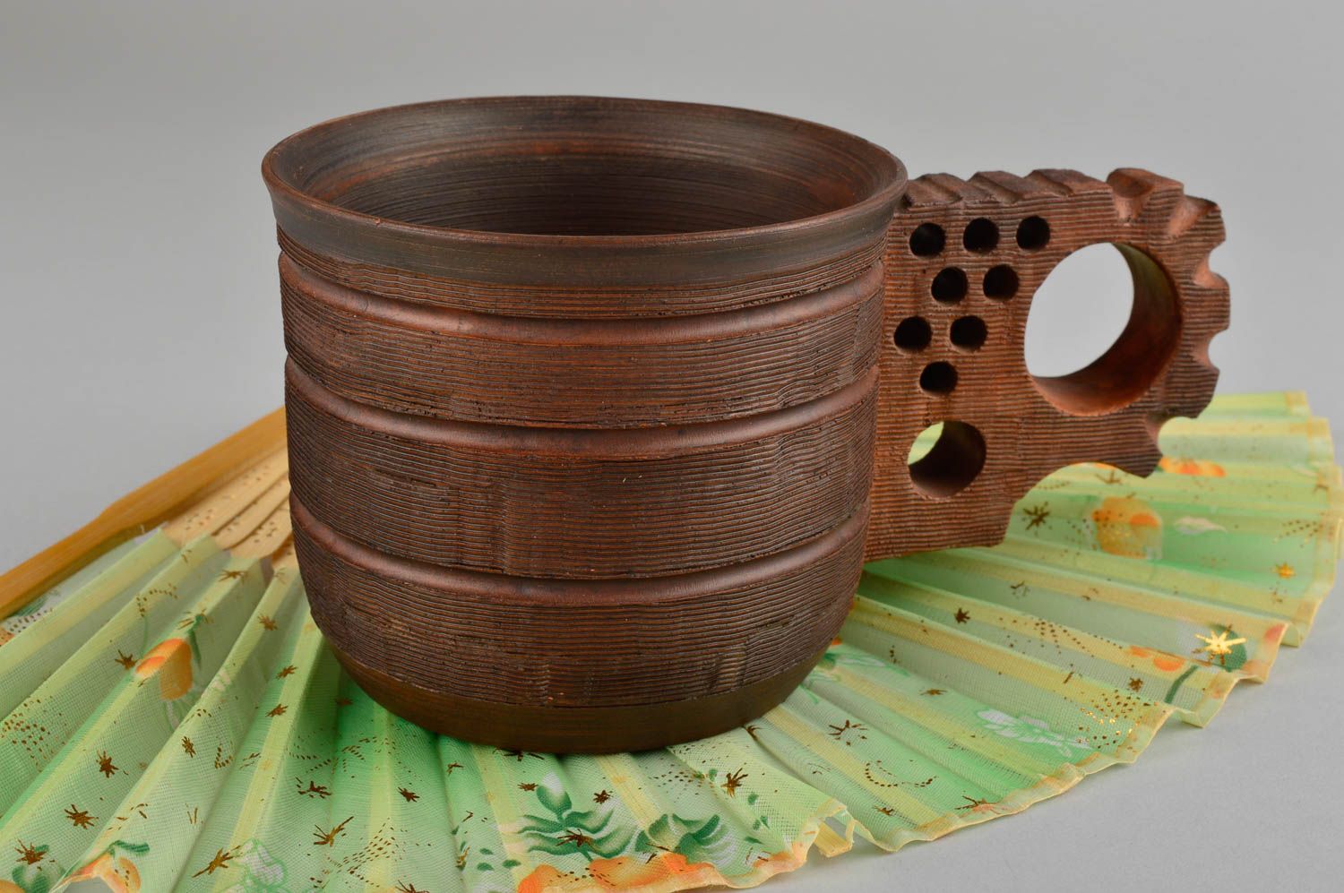 Art clay cup in brown color with cogwheels' shape handle photo 1