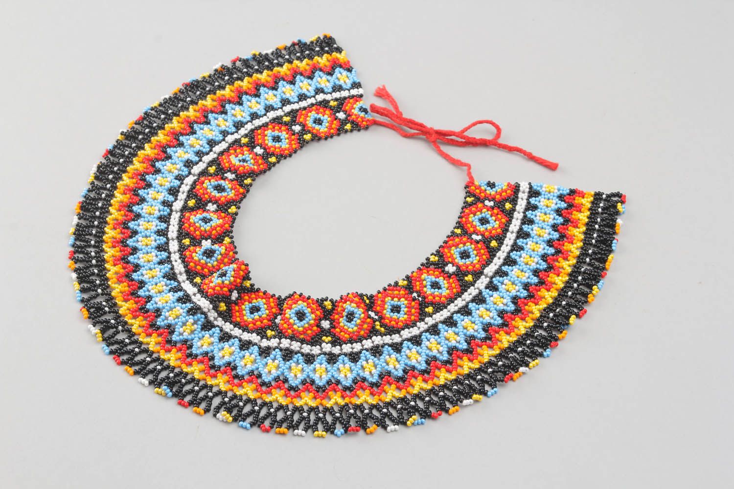 Broad beaded necklace with ornament photo 4