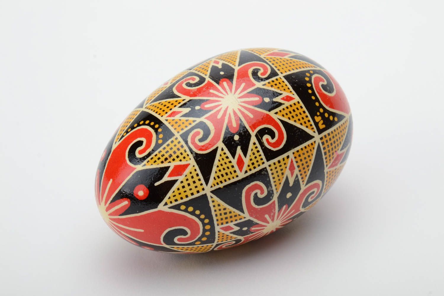 Homemade decorative Easter egg traditional pysanka painted in contrast colors photo 2