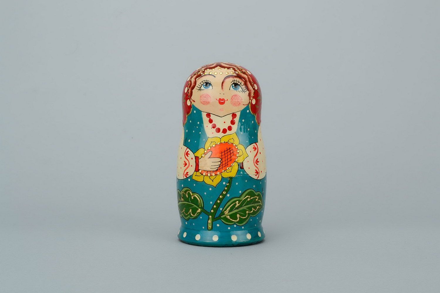 Wooden matryoshka doll with sunflower photo 1