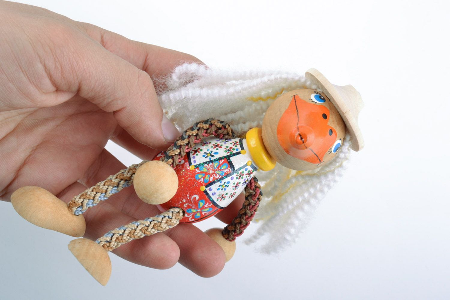 Handmade wooden toy in the shape of duck painted with eco dyes for children photo 2