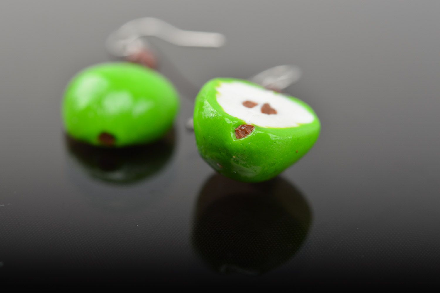 Bright lime and white handmade polymer clay earrings with charms in the shape of apple halves photo 4