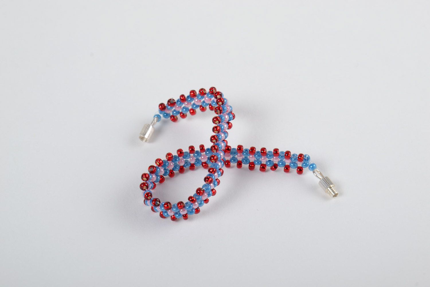 Girls' beaded bracelet made of Czech beads of red, pink, and dark blue color photo 4