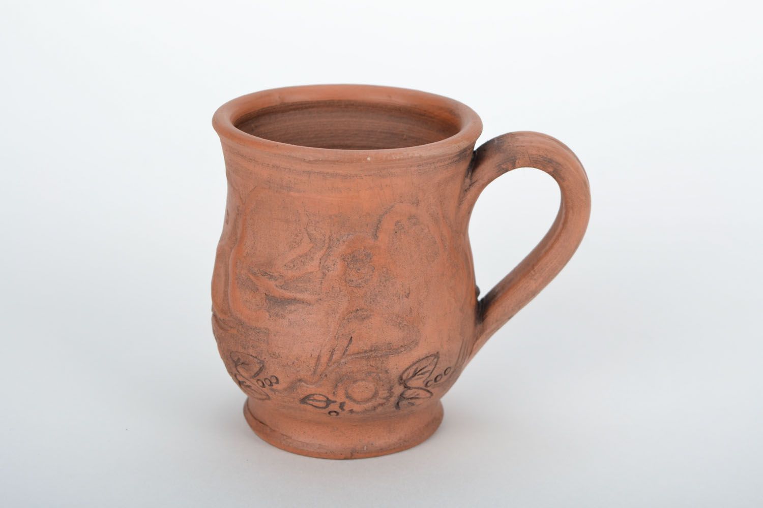Red clay drinking cup with rustic floral pattern photo 3