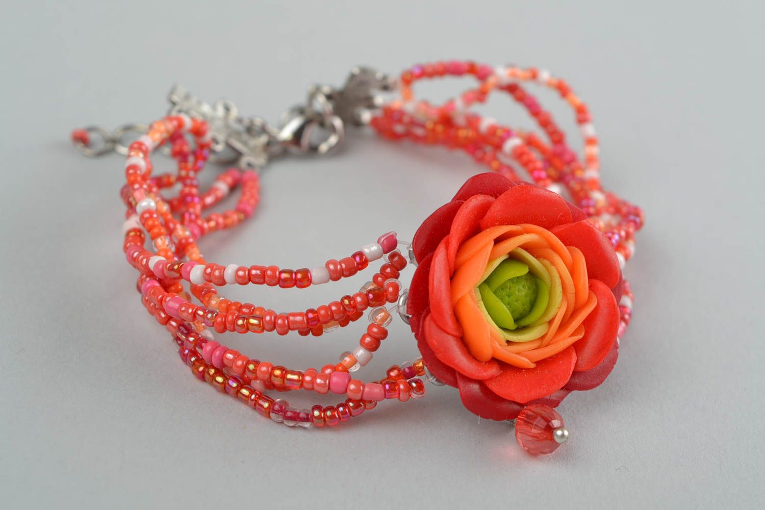 Handmade women's designer beaded wrist bracelet with red polymer clay flower photo 1