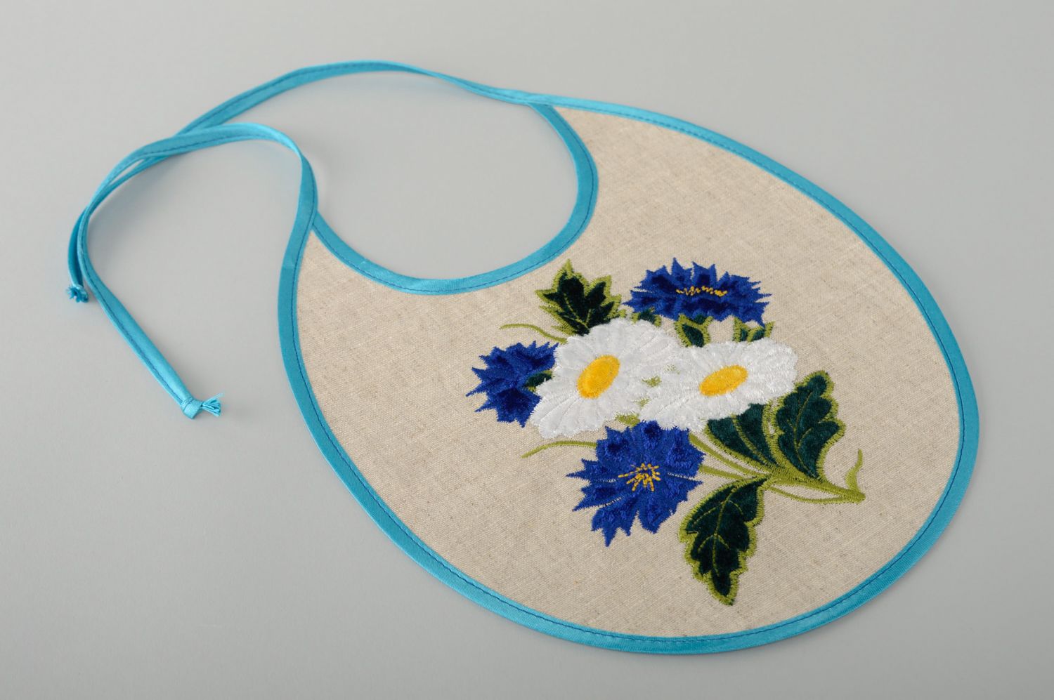 Handmade linen baby's bib with embroidery photo 1