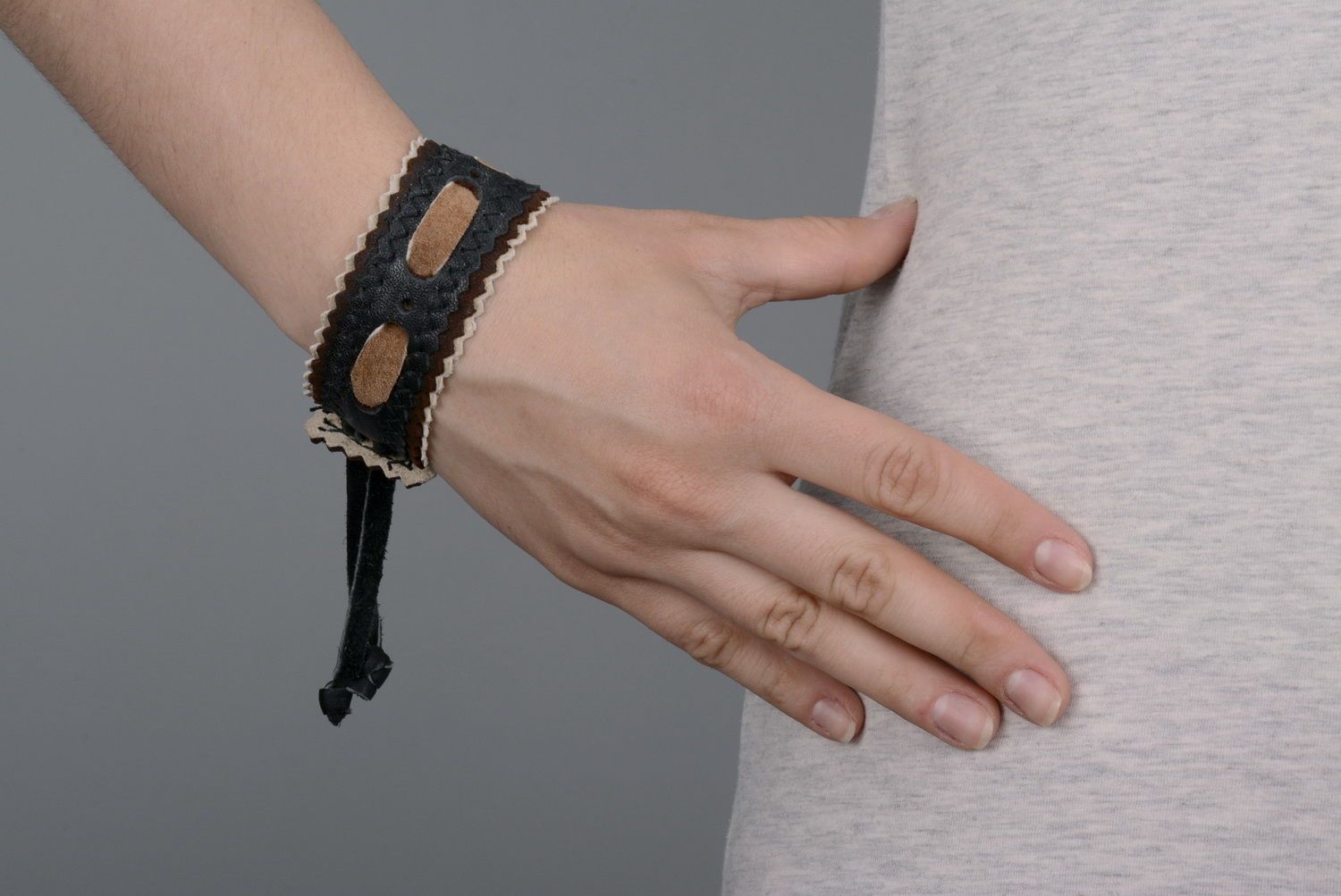 Black leather bracelet on the hand photo 5