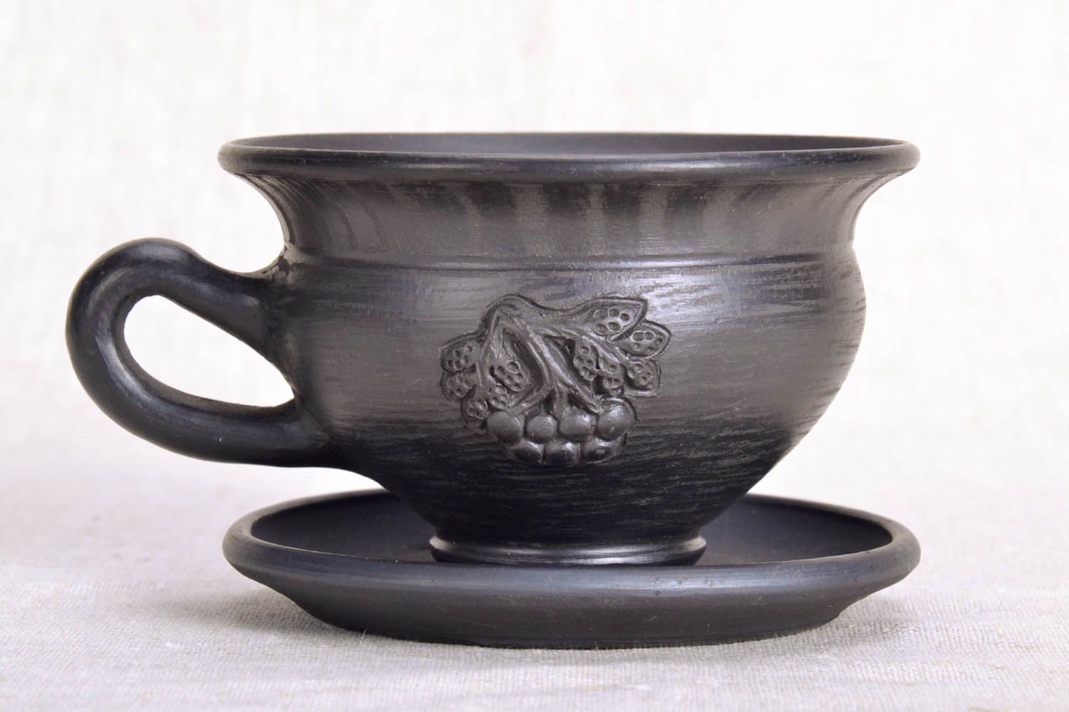 Smoked black clay glazed coffee cup with handle and saucer and grapes' pattern photo 1