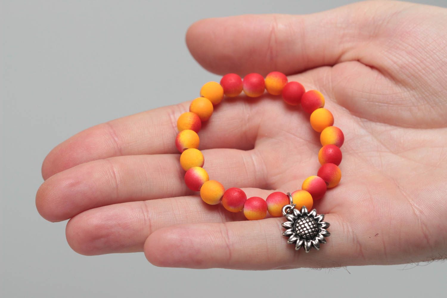 Yellow handmade designer children's bracelet with plastic beads Sunflower photo 5
