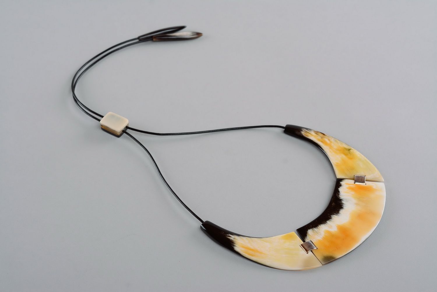 Necklet made of a cow horn photo 4