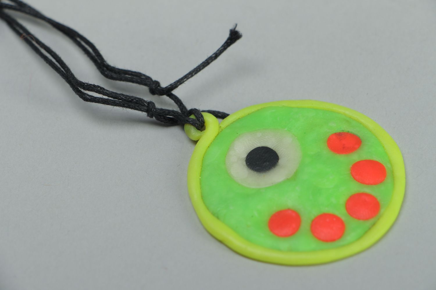 Round polymer clay pendant that glows in darkness photo 2