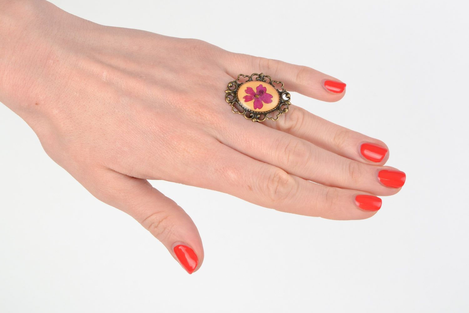 Handmade ring with vintage metal basis and real dried flower in jewelry resin  photo 1